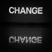 Black background with white letters spelling the word change.