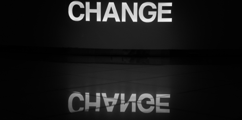 Black background with white letters spelling the word change.