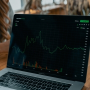 laptop with stock chart and info on screen