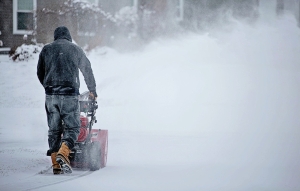 person with a snowblower
