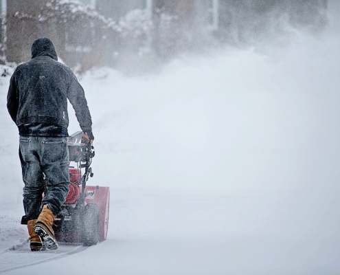 person with a snowblower