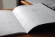image of open blank paper calendar indicating review of previous year and possibilities of new year