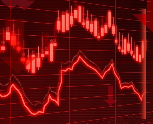 black screen with red lines trending down; carbon credit values falling