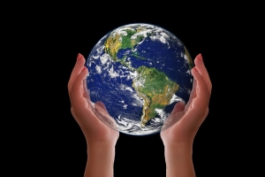 image of the earth held between two hands; 2024 International Propane Conference