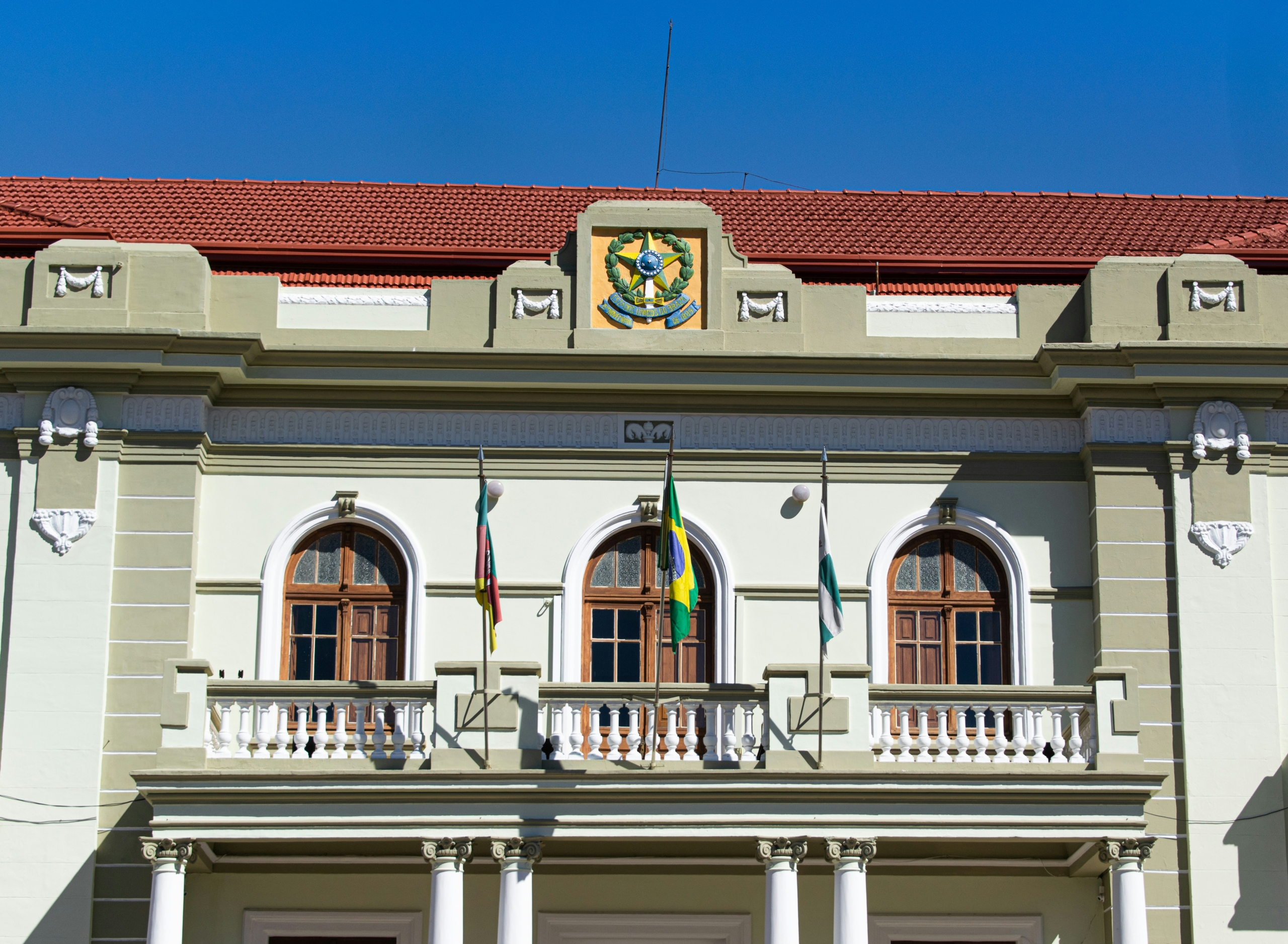 two-story building with balcony and Brazil flag hanging from it; Brazil - a changing energy market