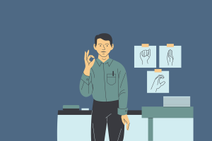 cartoon image of man in front of desk making a sign, pictures of sign language on wall