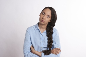 image of woman with crossed arms and frown on face; frustrated