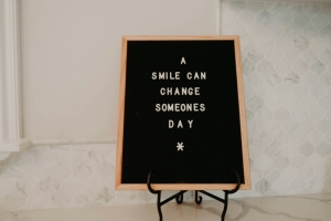 black board with white text -a smile can change someone's day; Soft Skills Matter - work ethic