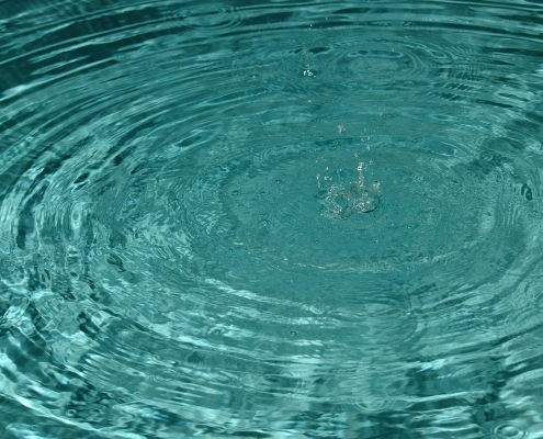 drop of water into a body of water causing circles of ripples; tariffs