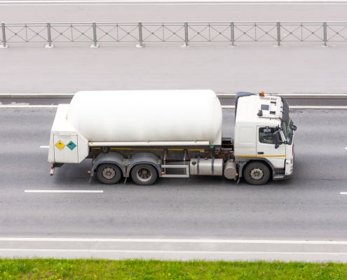 white fuel truck on road; Hedging 301 - financial options - how to use them